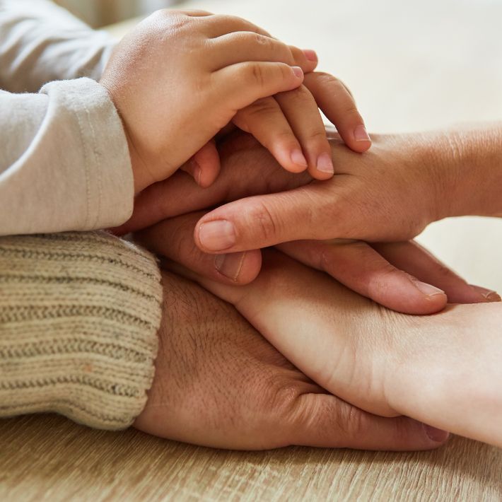 Photo of human hands of different ages on top of each other. Photo of human hands of different ages on top of each other.